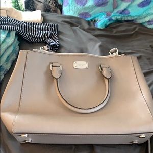 a large crossbody micheal kors  purse